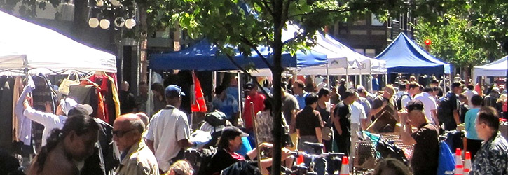 The Downtown Eastside Street Market at Pigeon Park on Carrall Street The Downtown Eastside Street Market at Pigeon Park on Carrall Street