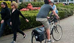People walking and cycling along seawall along False Creek People walking and cycling along seawall along False Creek