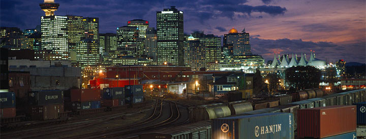 View of a CN train and Vancouver at night View of a CN train and Vancouver at night