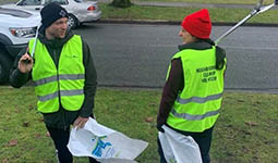 Photo of two Adopt-a-Block volunteers Photo of two Adopt-a-Block volunteers