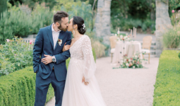 Photo credit: Maricle Kang Photography. Wedding couple kissing along a path in VanDusen Gardens Photo credit: Maricle Kang Photography. Wedding couple kissing along a path in VanDusen Gardens